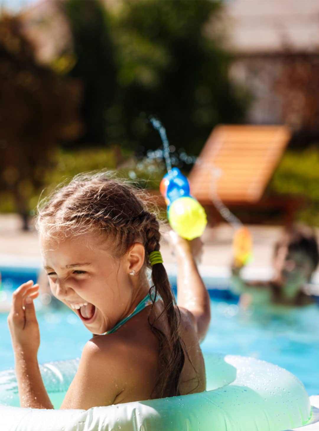 girl playing in pool