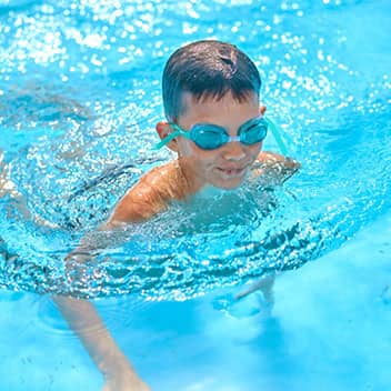 boy enjoying pool